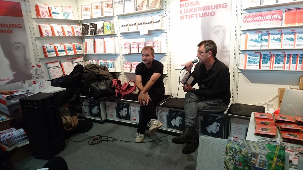 Frankfurter Buchmesse-Highlight: Abstauben in Brasilien. Deutsche Konzerne im Zwielicht